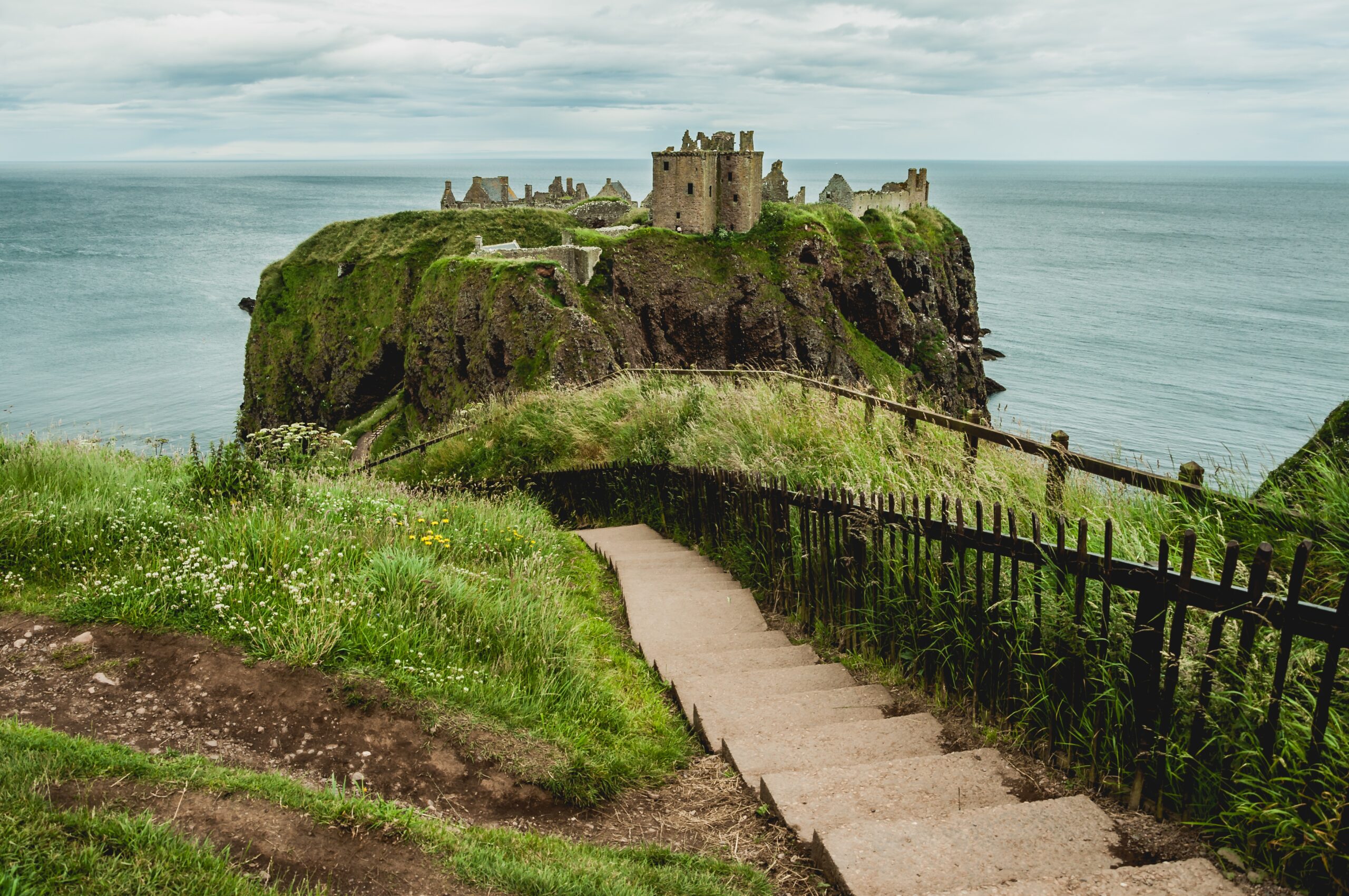 picture of concrete stairs against dunnottar castle in stonehaven, uk