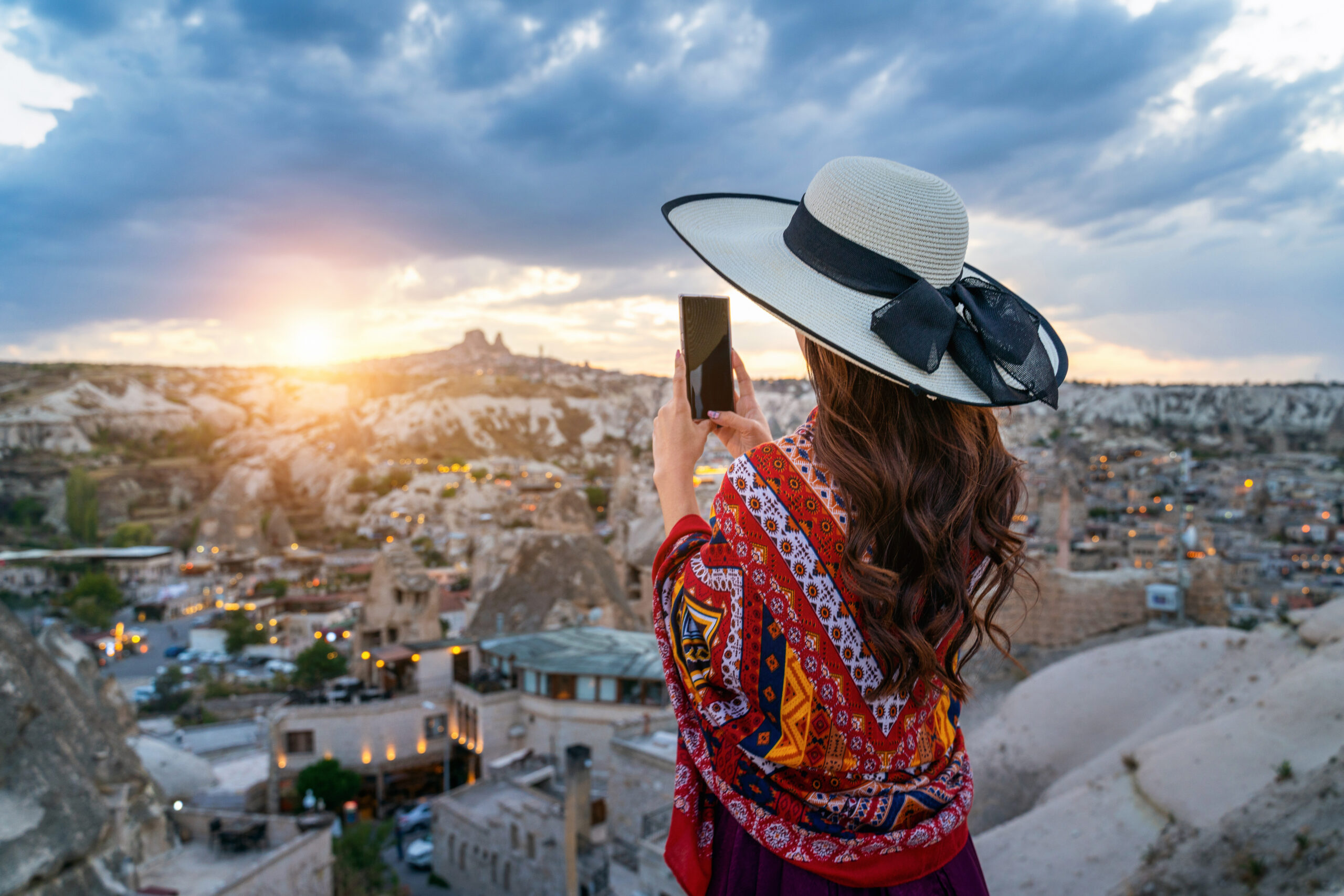 woman take a photo with her smartphone at goreme, cappadocia in